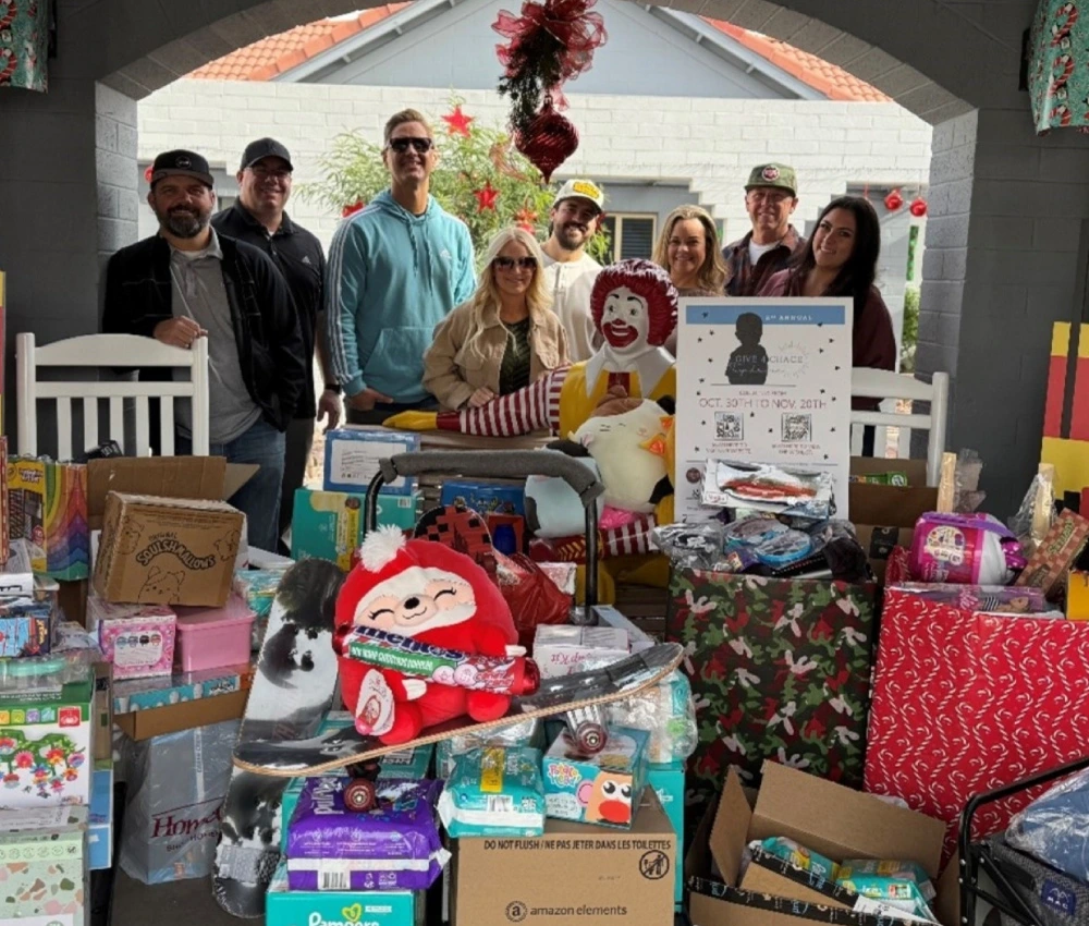 large collection of wrapped gifts to donate to our houseguests