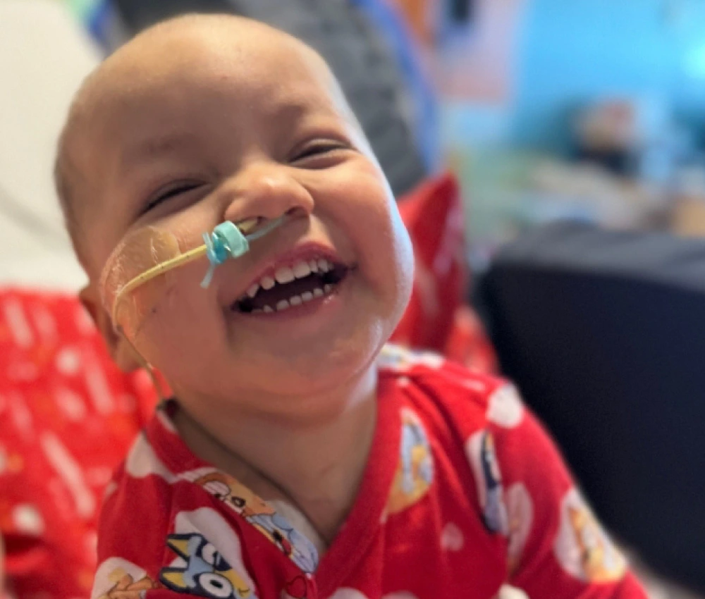 Two-year-old Feliciano Montes smiling brightly