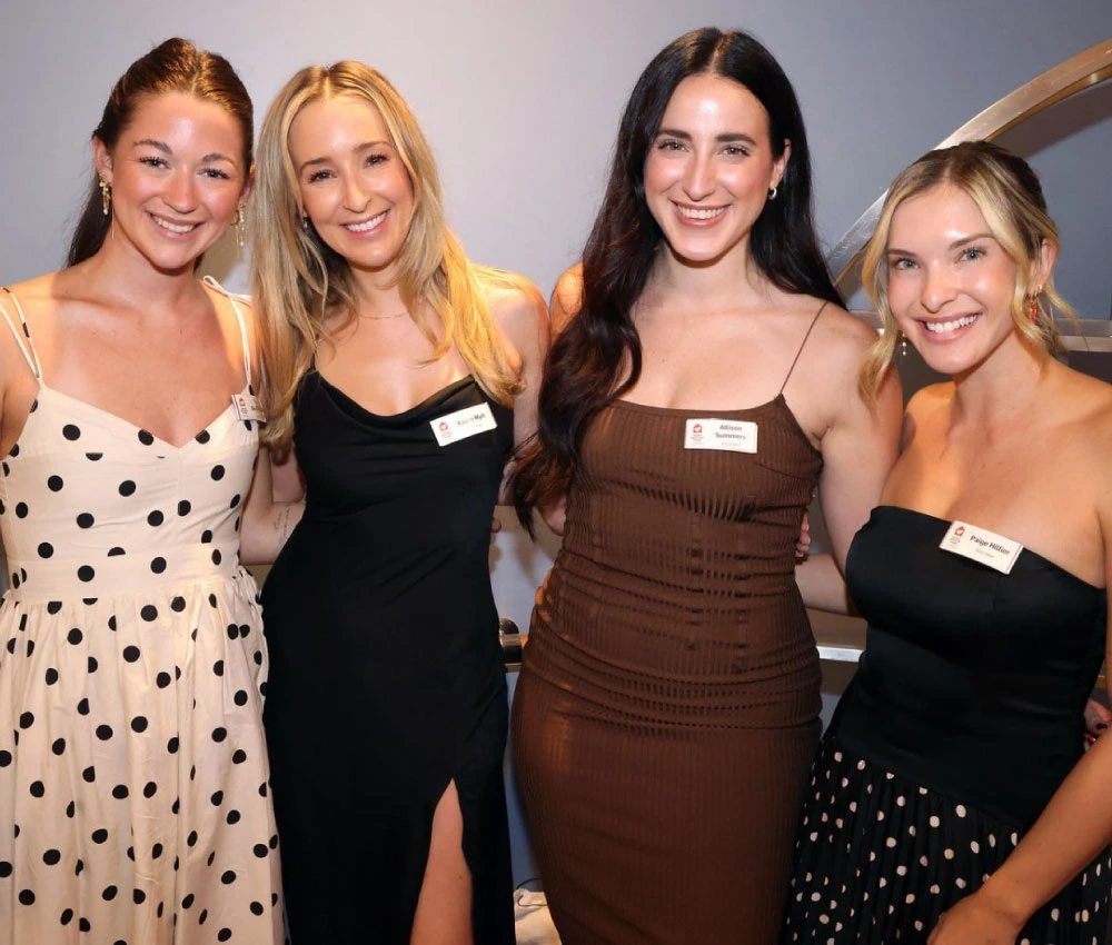 volunteers at a fundraisers event in formal evening wear