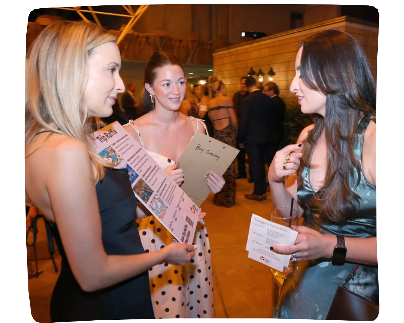 Two volunteers selling raffle tickets